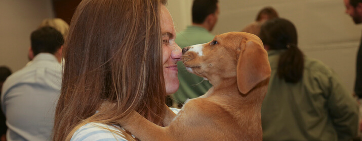 TEP employee holding puppy